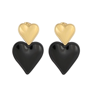 Two-tone heart drop earrings in gold and black stainless steel for a chic minimalist look