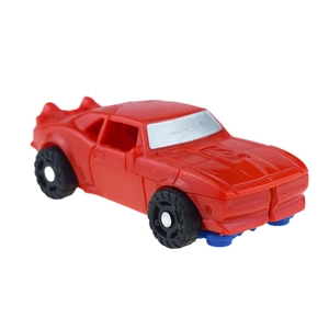 Detailed view of a red toy muscle car featuring transformation mechanical structures
