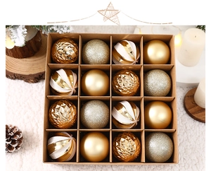 Detailed view of 16 gold and white Christmas baubles in a brown kraft paper gift box