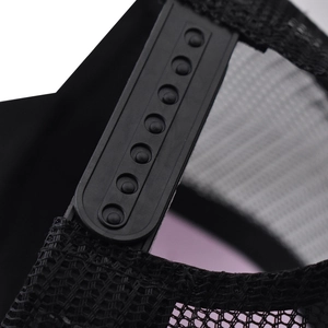 Detailed close-up of adjustable plastic snapback closure and breathable black mesh fabric