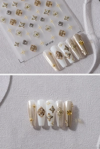 Macro detail of vintage gold and silver embossed floral nail stickers with starry patterns