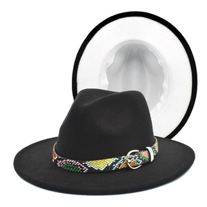 Close-up of black fedora hat with colorful snakeskin band and gold metal buckle detail