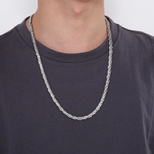 Silver braided twist chain necklace for men in minimalist stainless steel worn by model