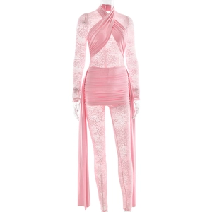 Close-up of pink lace jumpsuit featuring pleated fabric and elegant side ribbons
