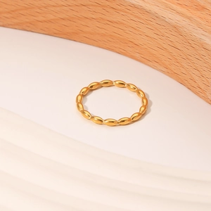 French minimalist gold titanium steel ring with elegant oval bead textured design