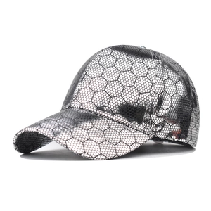 Silver metallic baseball cap with black honeycomb grid pattern and curved brim