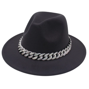 Detail of black fedora hat with silver chain and colorful crystal embellishments