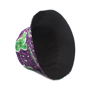 Detail of purple leopard bucket hat with green leaf print and black inner lining