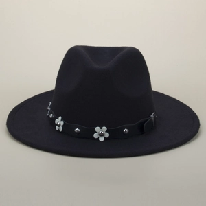 Detailed close-up of a black wool fedora featuring white floral accents and silver rivets