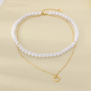 Elegant double-layered stainless steel necklace with baroque pearls and a heart pendant