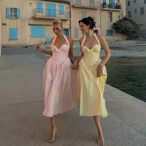 Halter neck corset midi dress with bow detail and A-line silhouette in pastel colors