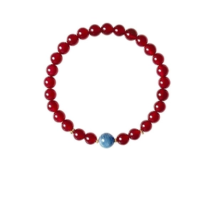 Red agate beaded bracelet with a blue crystal center stone and golden spacers