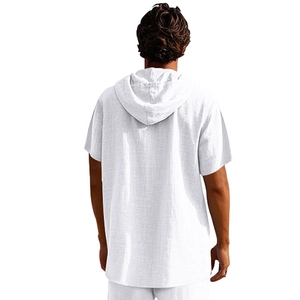 Detail of white linen hooded shirt showing the breathable fabric and back texture