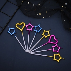 Star and heart shaped gold metallic party candles for cake decoration in mixed colors