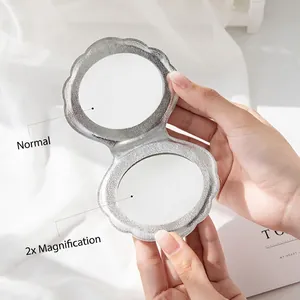 Silver shell-shaped folding compact mirror with double-sided normal and 2x magnification