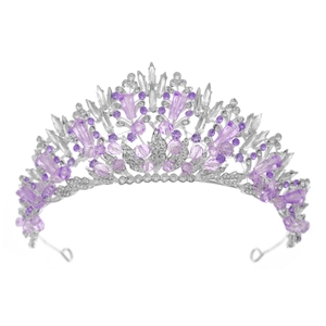 Detailed view of silver crown with purple crystals and sparkling rhinestones for bridal hair