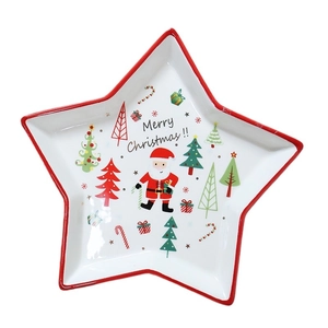 Star-shaped ceramic Christmas snack plate with Santa and tree illustrations