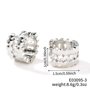 Detailed view of silver hoop earrings with dimensions 1.5cm by 1cm and weight 8.6g