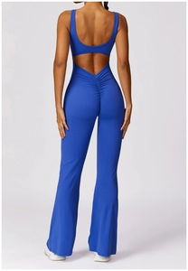 Detail of blue backless yoga jumpsuit featuring scrunch butt and flared leg design