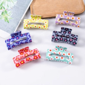 Floral square hair claws in six vibrant colors displayed on a minimalist white background