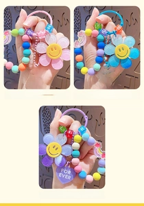 Detail of colorful smiley sunflower beaded keychains with heart pendants and love beads