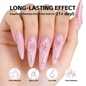 Detail of pink long stiletto nail art with 3D flower relief and rhinestone accents