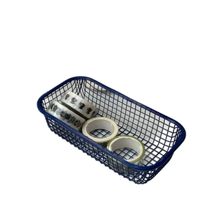 Blue rectangular wire mesh organizer basket with colorful decorative washi tape rolls