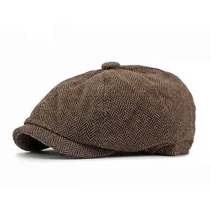 Vintage brown herringbone newsboy cap with classic 8-panel design and wool blend texture