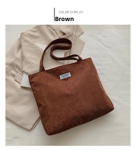 Detailed texture of brown corduroy tote bag with Fashion Instinct white label tag