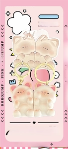 Close-up of cute 3D resin cat couple keychains with ROROJUMP heart packaging