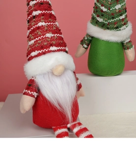 Detail of knit hats and faux fur beards on red and green Christmas gnomes figurines