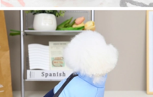 Detail of blue two-tone padded dog vest with zipper closure for warmth