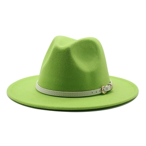 Detail of green wool felt fedora hat featuring a beige leather band with golden buckle
