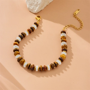 Adjustable stainless steel beaded chain bracelet in brown and gold with toggle clasp