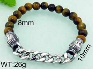 Macro detail of 8mm tiger eye stone beads and steel cuban link with buddha head
