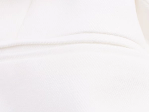 Macro shot of high-quality white linen blend fabric texture with sharp twill weave detail