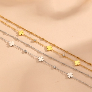 Double-layered stainless steel anklet with gold clover charms and zircon accents