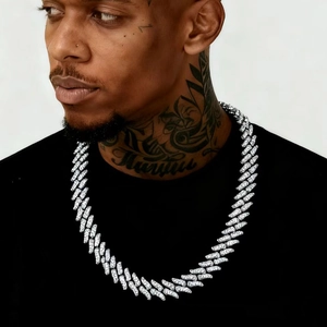 Iced out silver thorn fire Cuban chain necklace for men shown on a male model