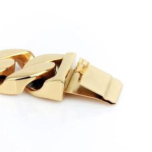Polished gold-tone stainless steel heavy Cuban chain bracelet with secure buckle