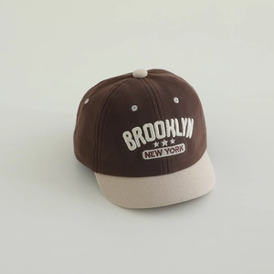 Detail of Brooklyn embroidery and striped fabric texture on the toddler baseball cap