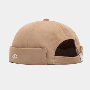 Detail of khaki miki hat showing white embroidery logo and adjustable back strap