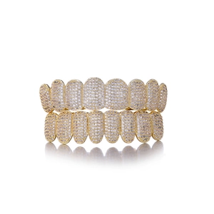 Golden hip-hop grillz set with full sparkling zircon stones on a white background