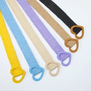 Elastic straw woven belts with heart buckles in various pastel colors on white background