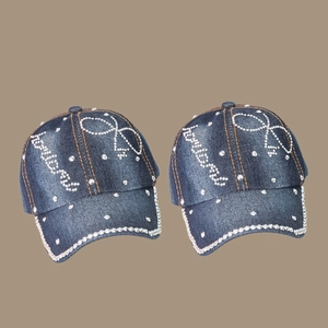 Denim baseball cap with sparkling rhinestone bow and Famous text for street fashion