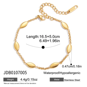 Detail of gold stainless steel cross bracelet with lobster clasp and extension chain