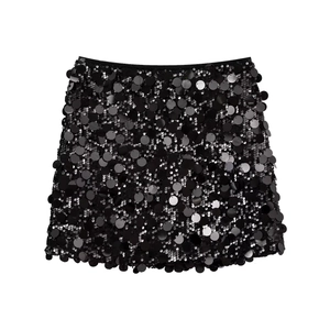 Detailed view of shimmering black sequins on a mini A-line skirt with reflective texture