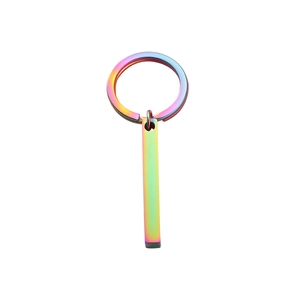 Detail of a rectangular stainless steel bar keychain with a vibrant rainbow mirror finish