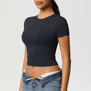 Close-up of slim-fit black yoga crop top showing high-elasticity breathable fabric