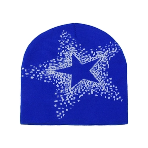 Detail of royal blue knitted beanie featuring a white pixelated star jacquard pattern