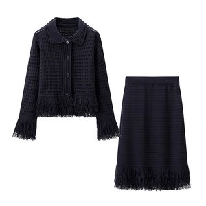 Women's black knit two-piece set featuring mesh cardigan and skirt with fringe trim
